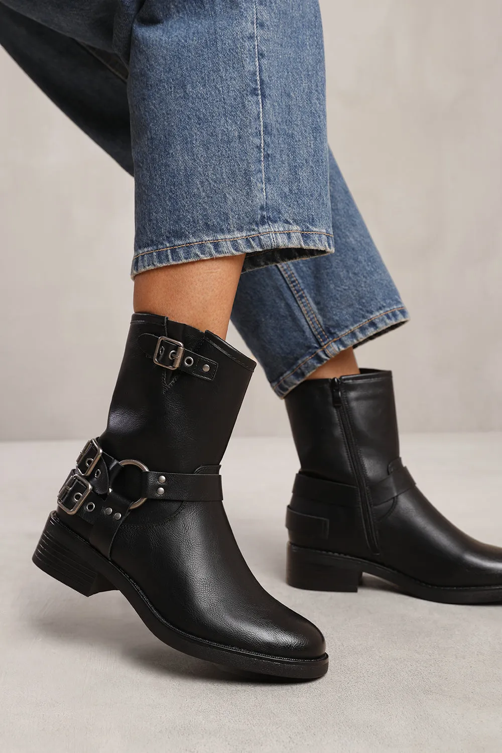 BODE ANKLE BOOT WITH BUCKLE DETAILING IN BLACK FAUX LEATHER